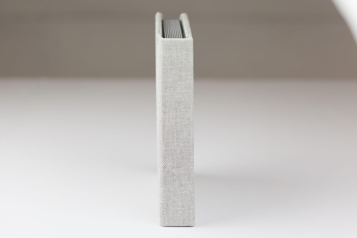 spine of a 6x6 carrera grey linen album