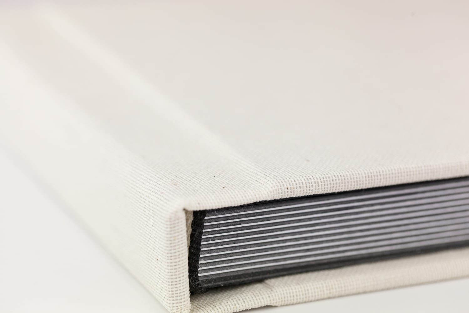 close up of vanilla linen with black page cores at lifethreads albums